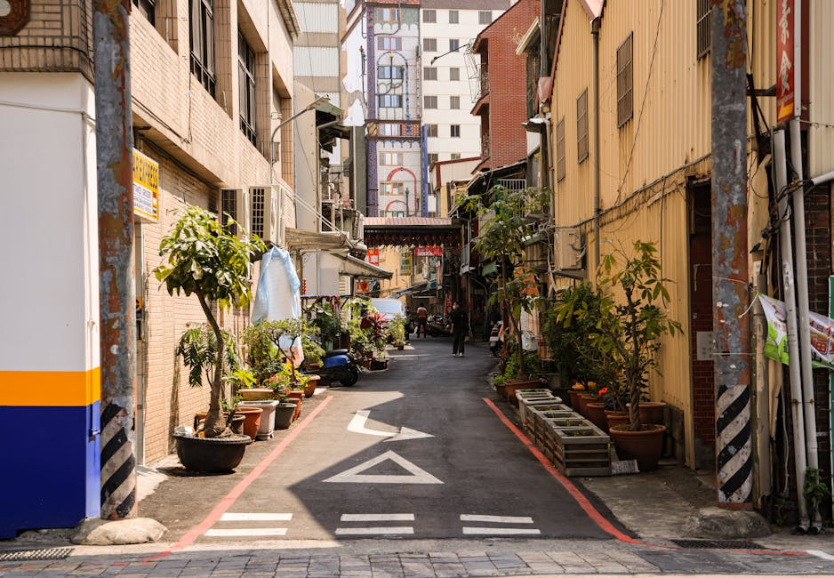 A rehearsal scene with performers working together under stage light